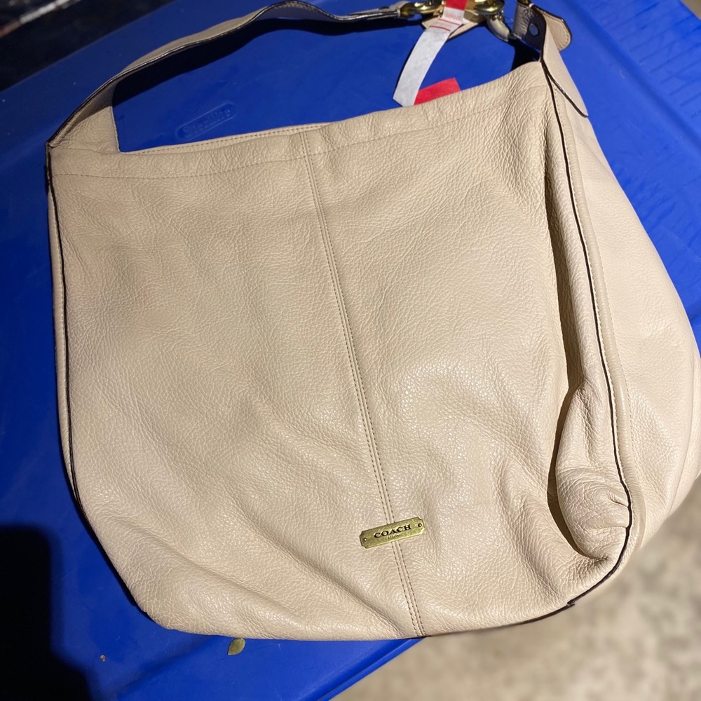Cream Coach leather tote with light blue interior